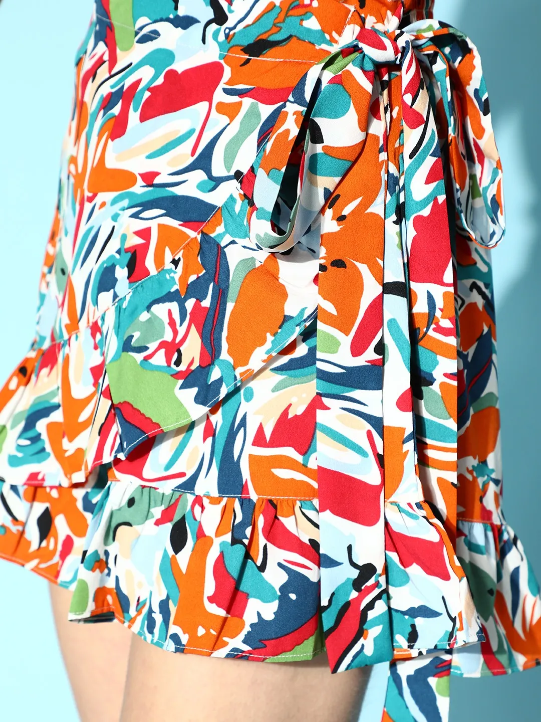 Berrylush Women White, Orange, & Blue Abstract Printed Side Tie-Up Ruffled Wrap Mini Skorts